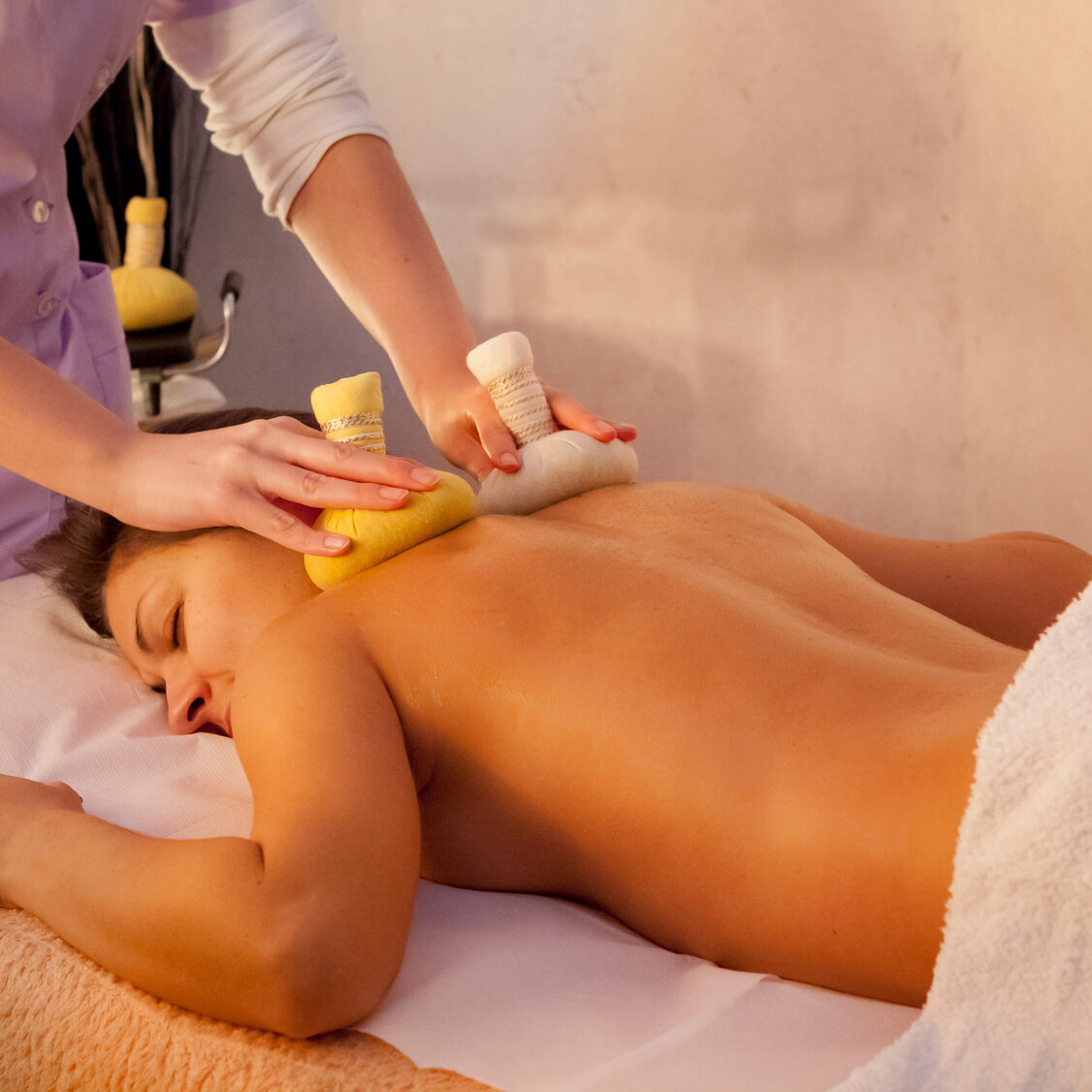 Woman getting back massage treatment